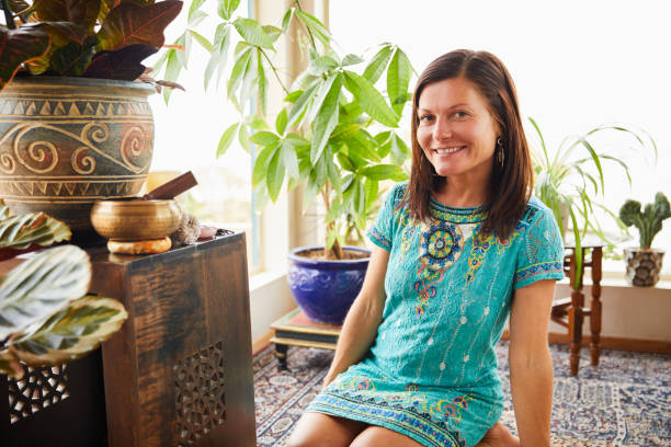 istock Smiling woman sitting in her alternative therapy studio 1185881052