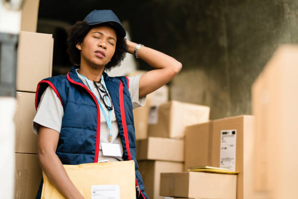 istock Black female deliverer taking a break while having a headache. 1185885096