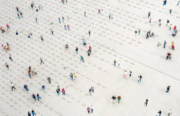 Crowd walking over binary code