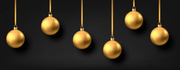 istock Golden  hanging Christmas balls isolated on black  background. 1185886229