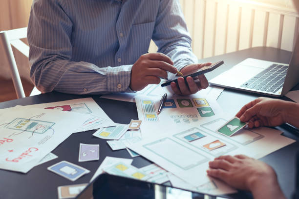 istock Designers planning to work together Draw application program in mobile phone and website development. 1185887295