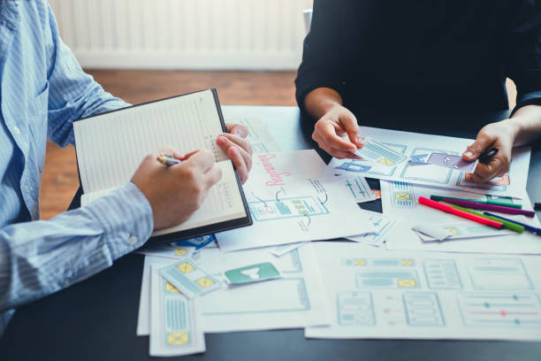 istock Mobile application designers plan together in the office. 1185887304