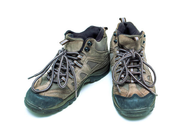 istock Old hiking boots isolated on white background 1185888888