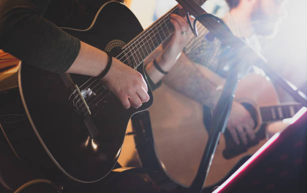 istock Midsection Of Men Playing Guitar 1185888941