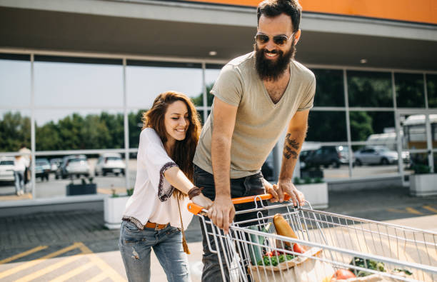 istock Young couple packing groceries 1185891352