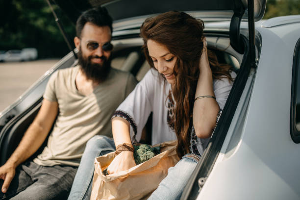 istock Young couple packing groceries 1185891356