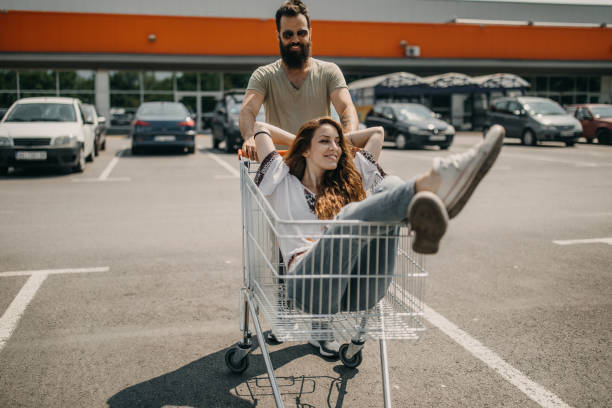 istock Young couple having fun while grocery shopping 1185891403