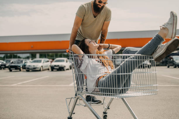 istock Young couple having fun while grocery shopping 1185891512