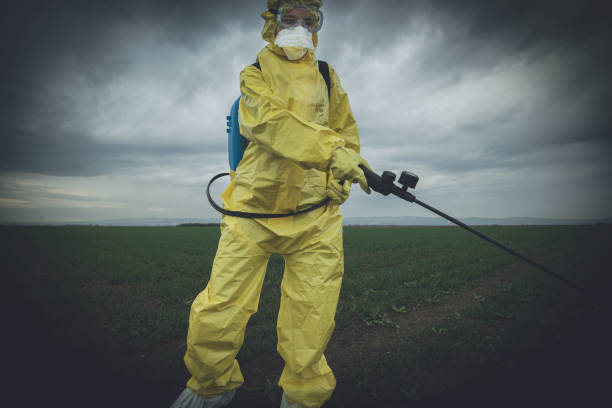 istock Worker spraying toxic pesticides 1185893985