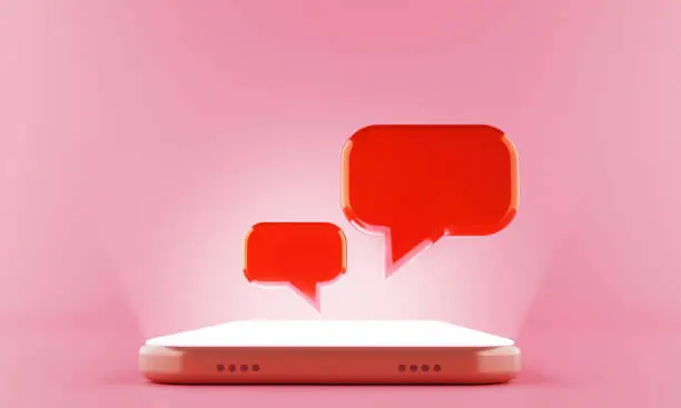 Photo of 3d rendering Chat speech bubble display floating on the shining screen Smartphone.