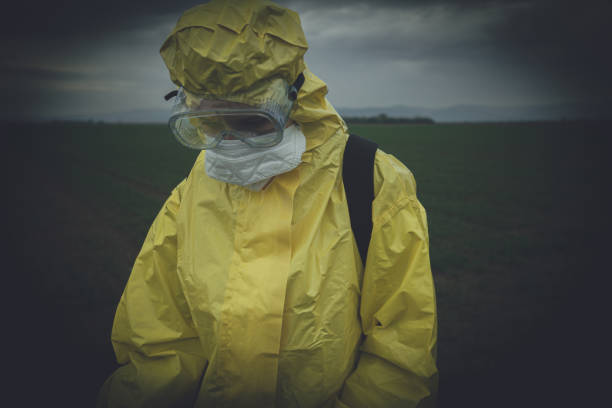 istock Worker spraying toxic pesticides 1185895575