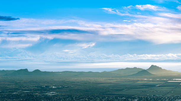 istock Desert and mountain landscape high-angle view with clouds and blue sky 1185895908