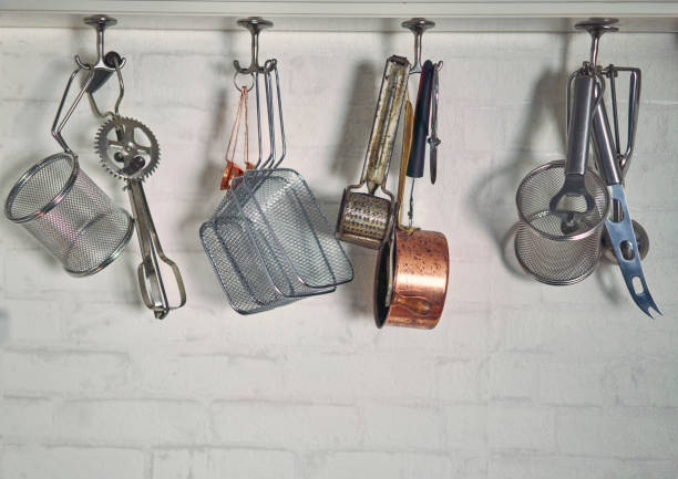 istock Kitchen Utensils Hanging in Domestic Kitchen 1185897331