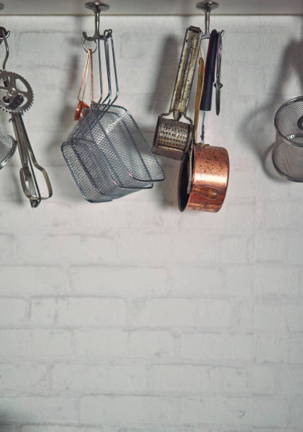 istock Kitchen Utensils Hanging in Domestic Kitchen 1185897422