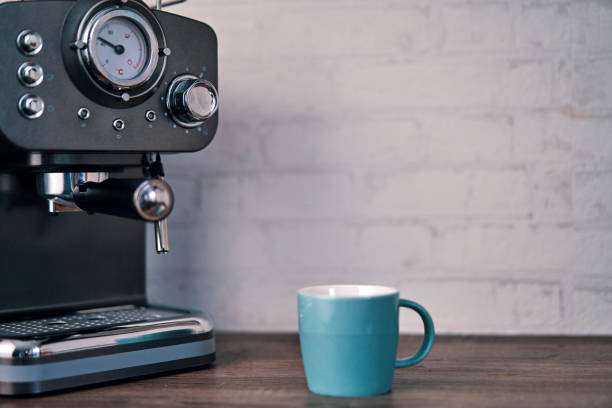 istock Mug and Espresso Machine in Domestic Kitchen 1185897434