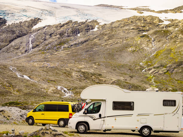 Camper car in norwegian mountains Camper in norwegian mountains. Camping on nature. Traveling, holidays and adventure concept. RV truck stock pictures, royalty-free photos & images
