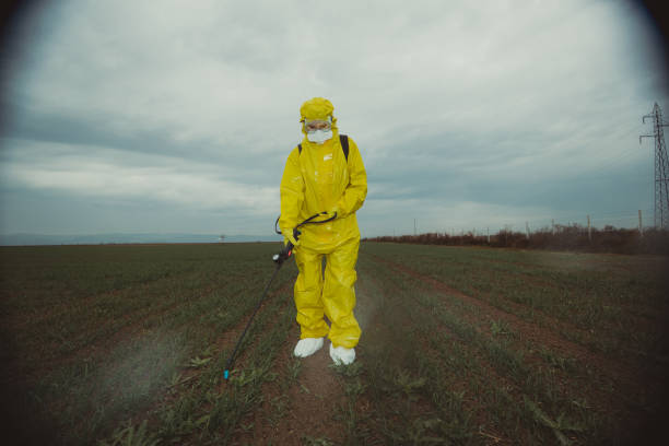 istock Worker spraying toxic pesticides 1185897894