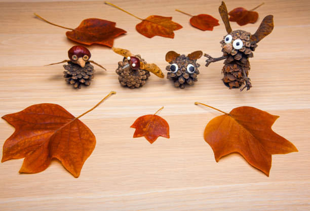 istock handmade cone figure autumn leaf wooden table 1185898656