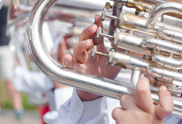istock Human hand playing the flugelhorn 1185898856