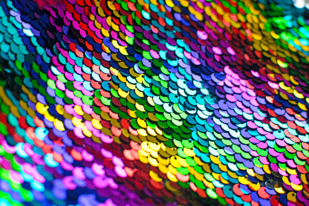 istock Pieces of cloth with multi-colored sequins. Glitter background. Sequin texture. 1185905055