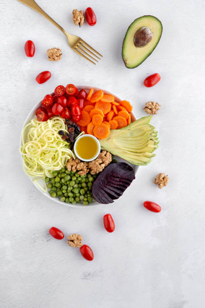 istock Raw vegan salad with assorted vegetables 1185908145