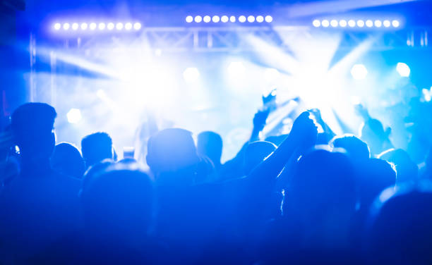 istock Crowd enjoying a rock music event 1185910381