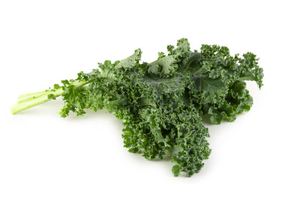 istock Fresh organic green kale leaves isolated over white background 1185912375