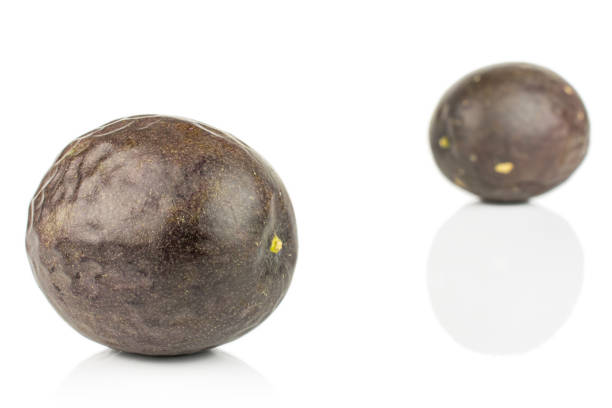 istock Sweet dark passion fruit isolated on white 1185915892