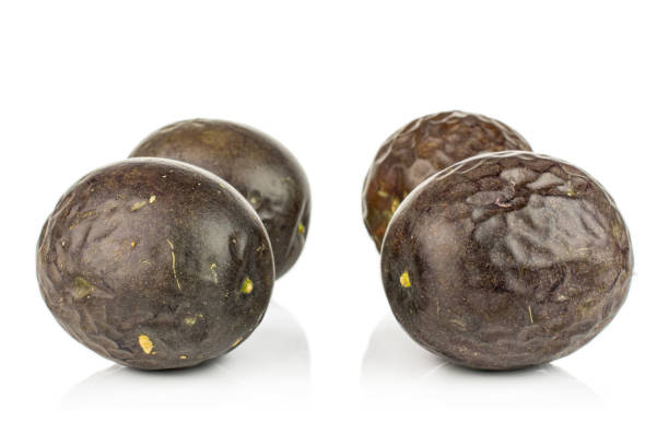 istock Sweet dark passion fruit isolated on white 1185916515