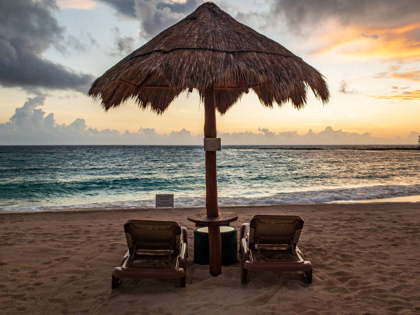 istock Cancun Resort - Pool Chairs overlooking beach 1185916522