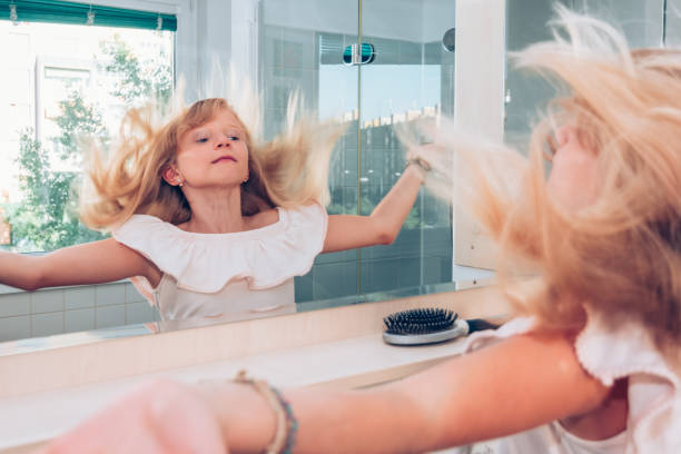 istock child having fun with long blond hair 1185916686