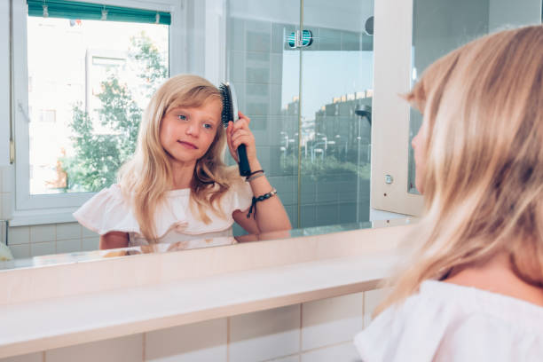 istock morning routine in the bathroom while brushing long hair 1185916834