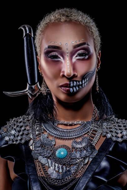istock Beautiful black warrior princess in studio shot 1185916859
