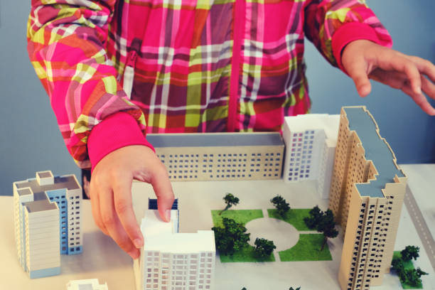 istock The child plays in the builder - training in the development of new cities 1185918865