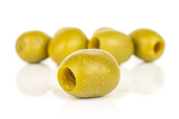 istock Green pitted olive fruit isolated on white 1185919144