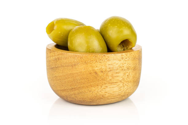 istock Green pitted olive fruit isolated on white 1185919260