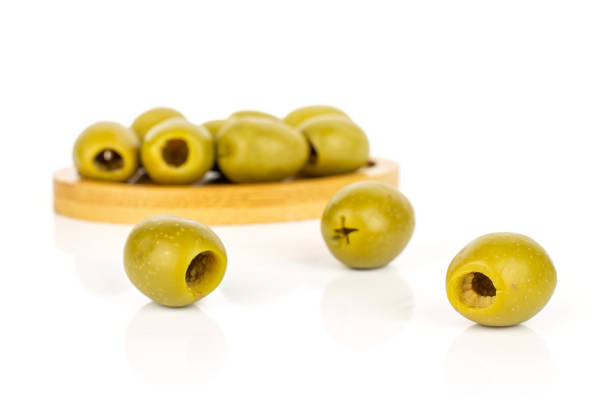 istock Green pitted olive fruit isolated on white 1185919344