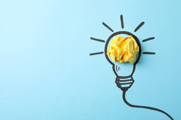 istock Drawn light bulb on blue background. Good idea concept 1185920639