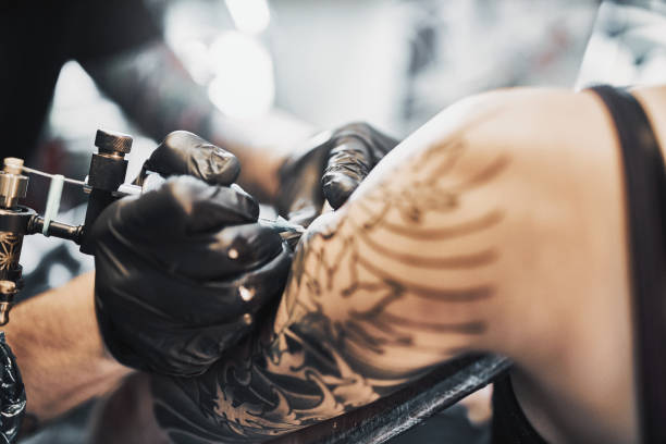 istock Tattooing a shoulder. Close-up shot 1185921812