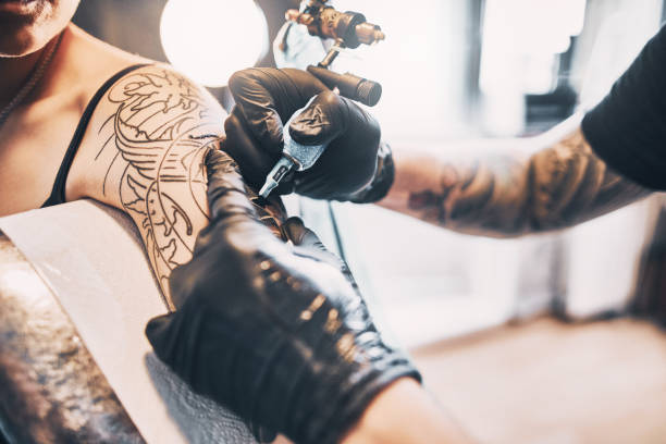 istock Tattooing a shoulder. Close-up shot 1185922023