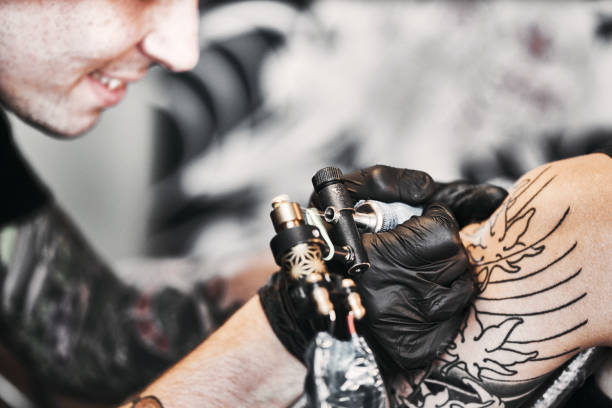 istock Tattooing a shoulder. Close-up shot 1185922172