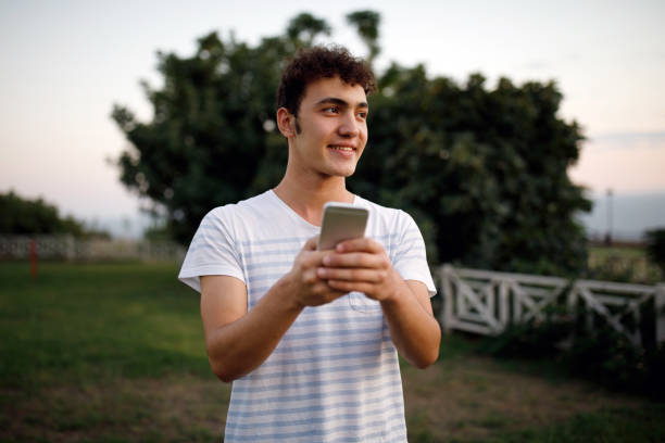 istock Teenager boy texting message 1185926191