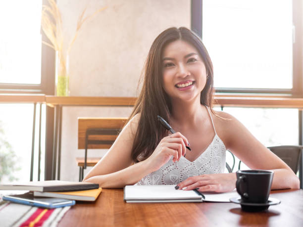 istock young Asia woman think about her work 1185926361