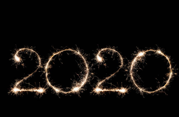 istock Number 2020 written sparkling sparklers isolated on black background 1185927890