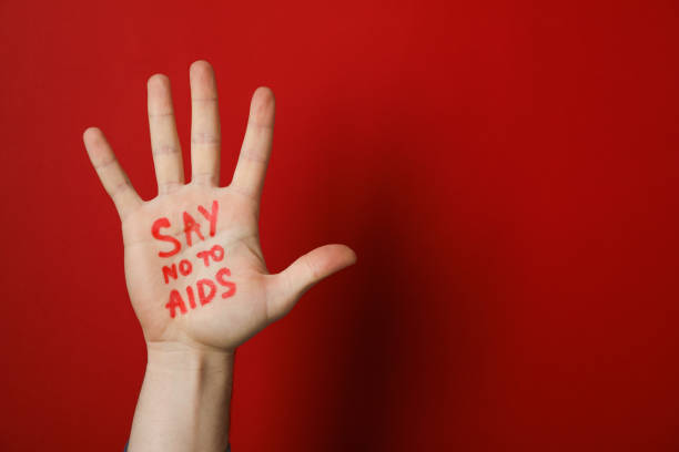 istock Hand with inscription Say no to AIDS on red background, copy space 1185928360