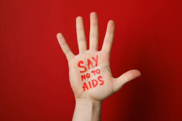 istock Hand with inscription Say no to AIDS on red background, copy space 1185928390