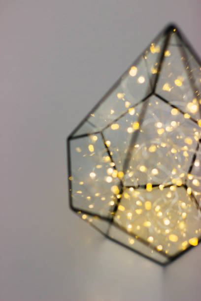 istock Garland in geometric glass florarium. 1185929374