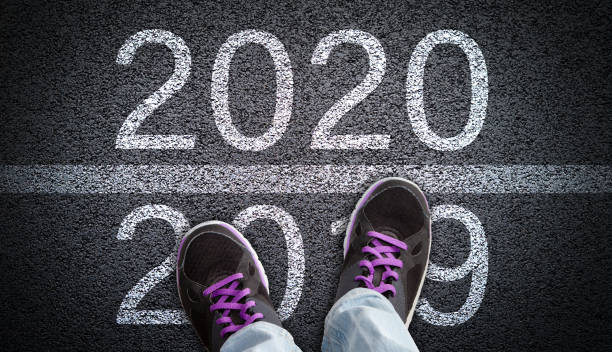 istock Stepping From 2019 Into New Year 2020 Concept 1185929680