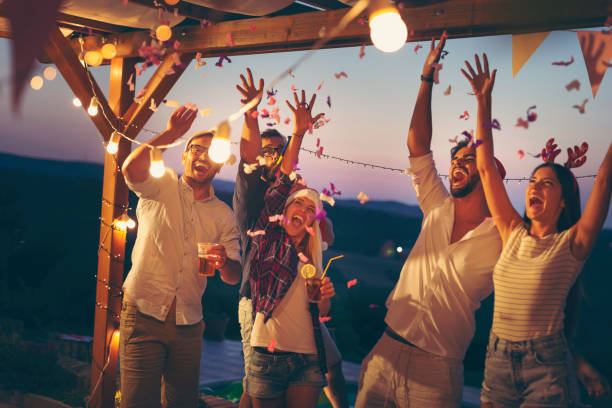 istock Friends having fun at poolside New Year party 1185932386