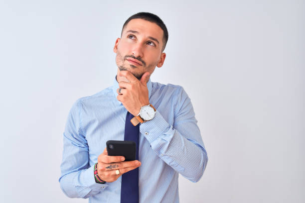 istock Young handsome business man using smartphone over isolated background serious face thinking about question, very confused idea 1185933745